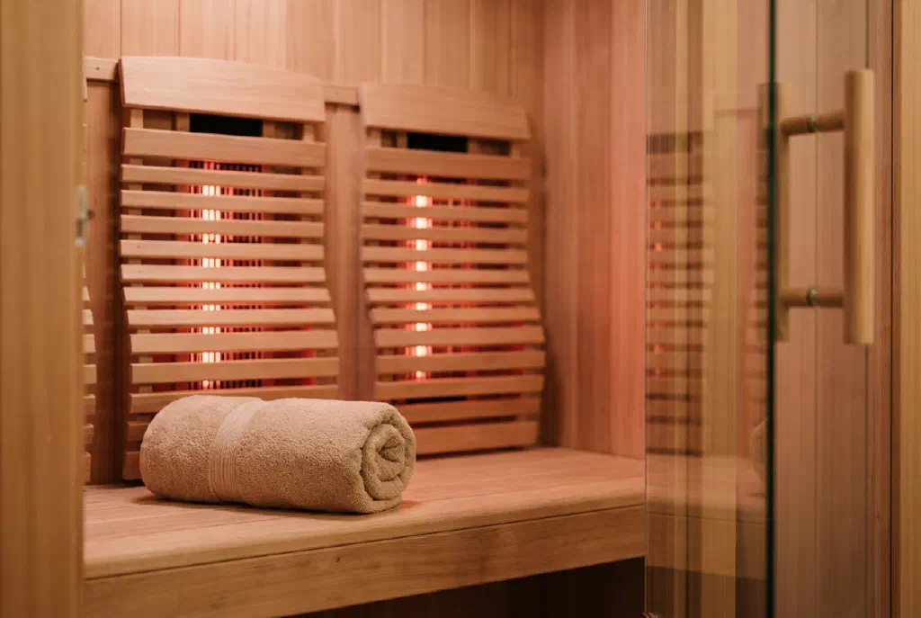 Cozy infrared cabin made of light wood with warm lighting